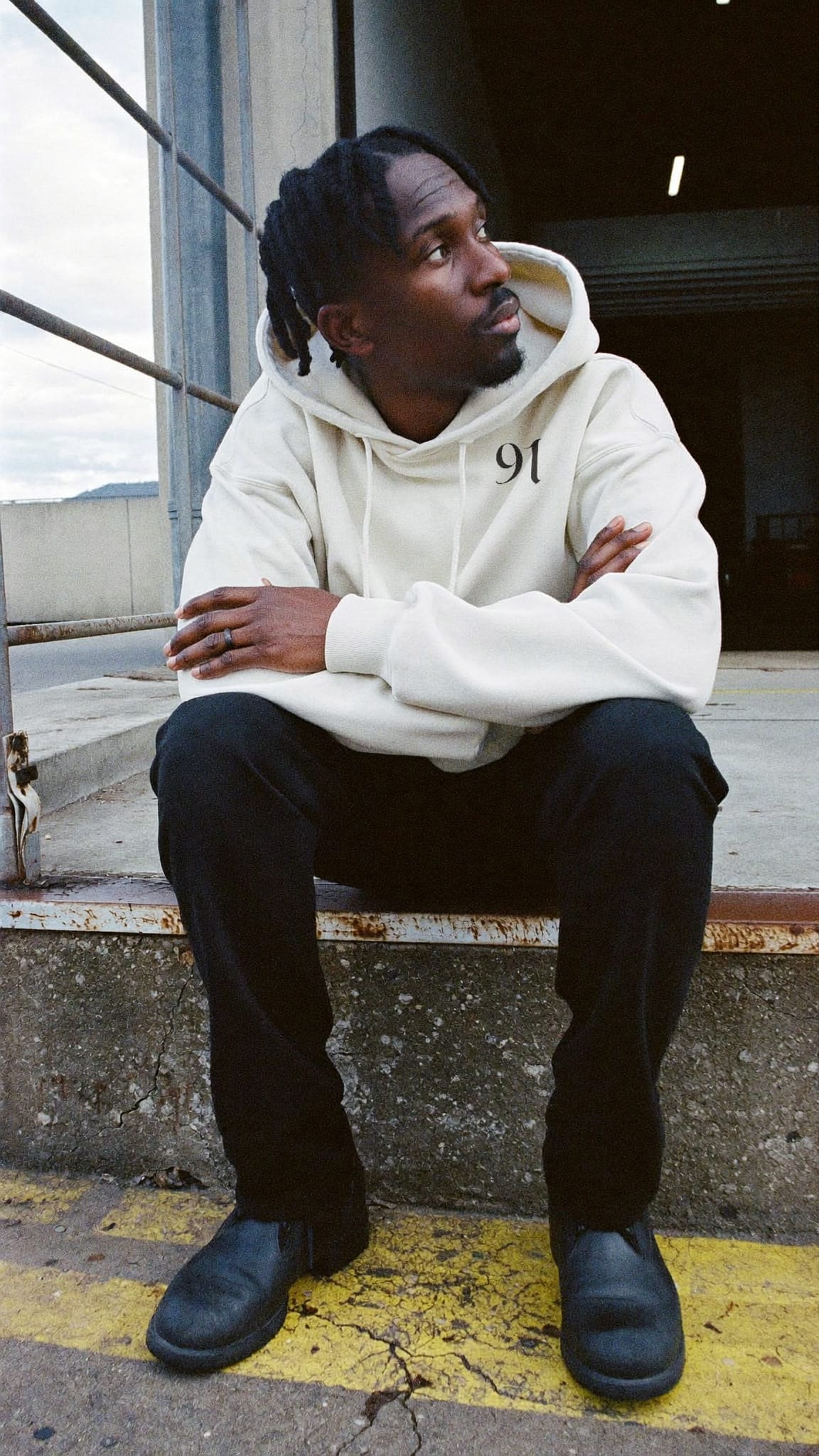 Off-white heavyweight hoodie with a small black 91 mark on the left chest